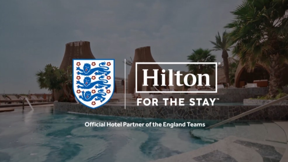 End frame from the Hilton FA showcase: the England badge beside the Hilton For The Stay lockup, over a poolside scene.